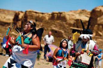 Hopi Dancers Sunnirae Suqnevahya, Eric Poneoma and Sunbeam Suqnevahya dance at Pueblo Bonito on Tuesday at Chaco Canyon. The Hopi dancers performed as part of the summer solstice celebration at the Nation Historic Park. © 2011 Gallup Independent / Brian Leddy 